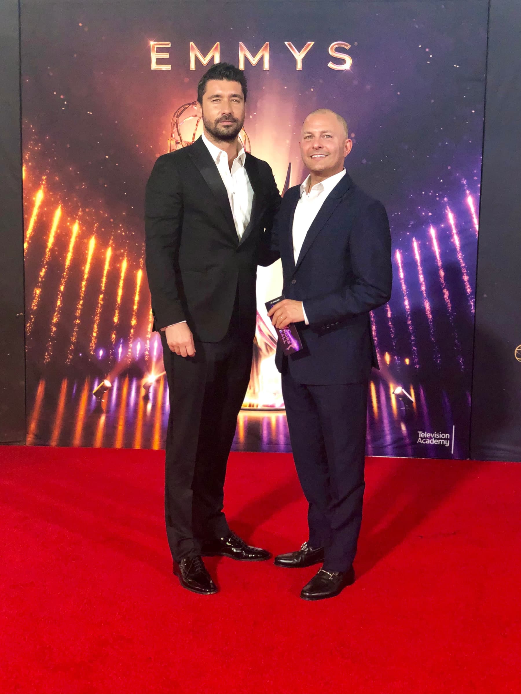 Barry Poznick on the Emmys red carpet with a colleague
